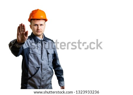 Engineer builder shows a prohibitory gesture. Focus on hand builder. Blur. isolated