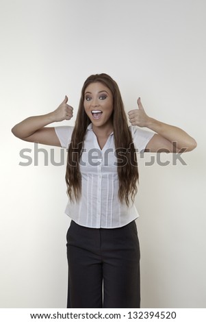 Happy beautiful business woman showing thumb up symbol with both hands