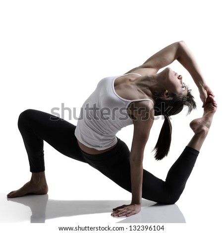 yoga, portrait of sport girl doing yoga stretching exercise, studio shot in silhouette technique over white background