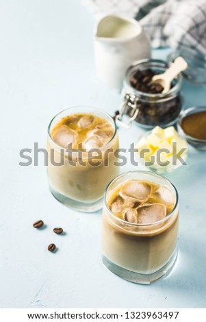 Iced bulletproof coffee. Selective focus, space for text.