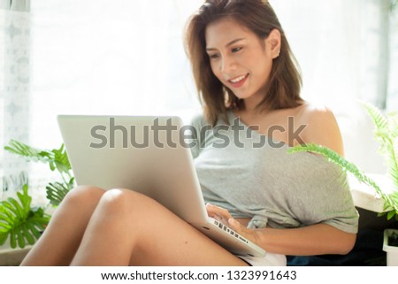 New generation working online on laptop by technology internet and wriless, Asian beautiful girl aren doing job everywhere by internet 
