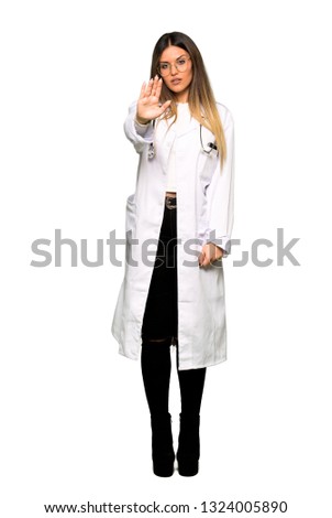 Full body of Young doctor woman making stop gesture denying a situation that thinks wrong