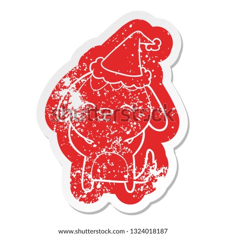 happy quirky cartoon distressed sticker of a dog wearing santa hat
