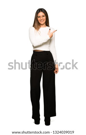 Full body of Pretty woman with glasses pointing to the side to present a product