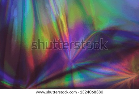Holographic real texture, wrinkled foil in blue pink green colors with scratches and irregularities.