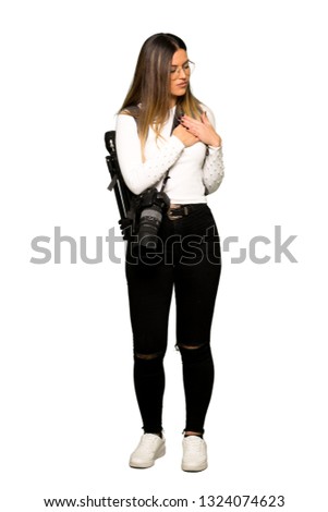 Full body of Young photographer woman having a pain in the heart