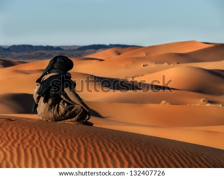 Touareg looks in the desert Royalty-Free Stock Photo #132407726