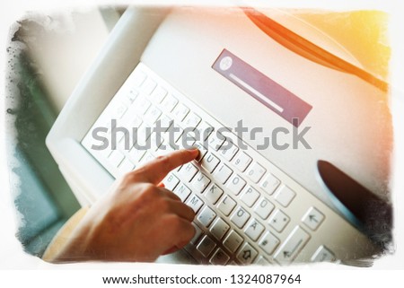 Vintage frame effect over woman finger pressing the Z letter button on the metallic keyboard of ATM Automatic Teller Machine to withdrawal retrieve money or use other finance instrument.