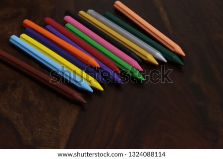 Crayons shot form above with. Shallow depth of field for dreamy feel, colorful crayons background, Macro of some colored wax crayons on a white background, creative colorful photography