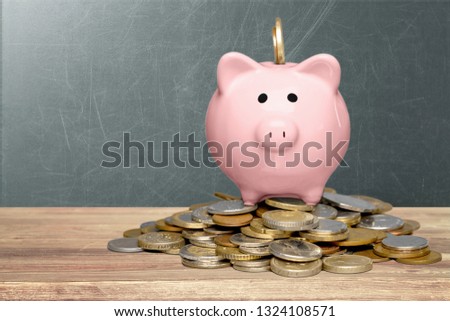 Piggy bank and coins on white background