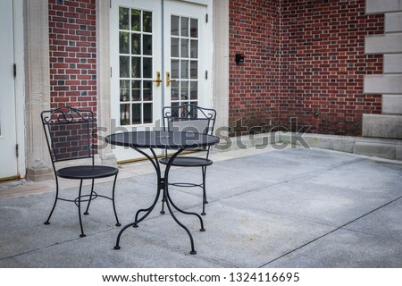 Concrete and Brick Patio w/ Table & Chairs (2) Royalty-Free Stock Photo #1324116695