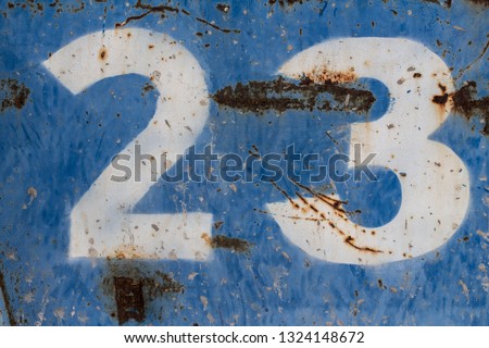 number twenty three painted on rusty blue metal, number 23, rusty background