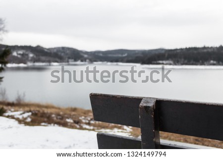 bench corner overlooking the lake out of focus background blur