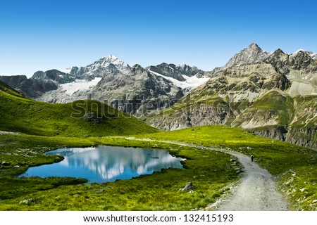 Amazing view of touristic trail near the Matterhorn in the Swiss Alps. Royalty-Free Stock Photo #132415193