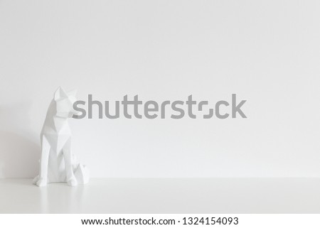Origami fox design sculpture home decor near white wall mock up.