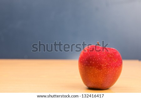 picture of apples with a background of school board