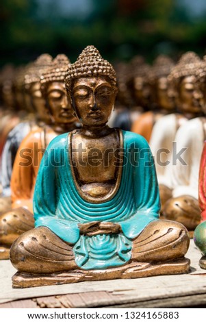 Buddha statue figures sold as a traditional souvenir on Ubud market, Bali, Indonesia. 