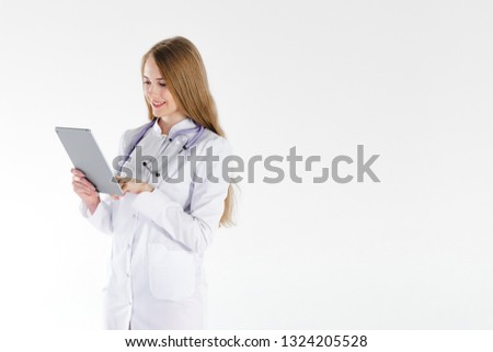 Girl doctor blond young light background studio day beautiful one positive tablet looking smiling concept of remote customer care online patients.