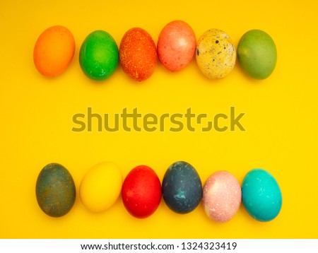 Decorated Colorful Easter eggs on yellow background . Space for text, Design, visual art, minimalism
