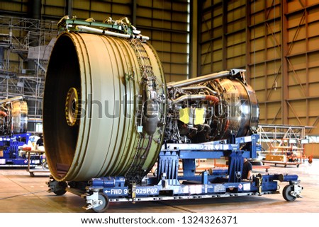 Jet engine remove from aircraft (airplane) for maintenance at aircraft hangar.Jet engine maintenance and change part by aircraft technician . Royalty-Free Stock Photo #1324326371