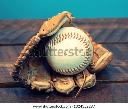 Top  View of softball resting in glove  