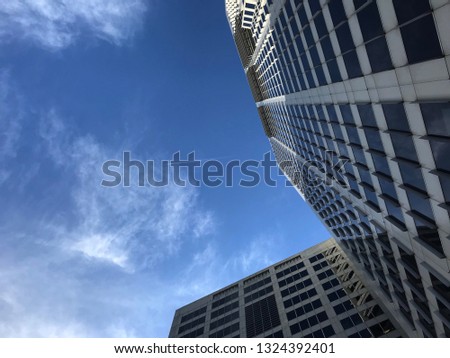 Bottom view of modern buildings and blue sky in Sydney.