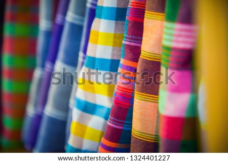 Layer of colorful fabric,background of colorful fabric, Colorful Traditional Sarongs in Thailand
