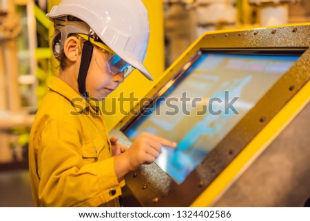 Boy operator recording operation of oil and gas process at oil and rig plant, offshore oil and gas industry, offshore oil and rig in the sea, operator monitor production process, routine daily record