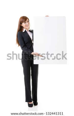 Attractive business woman hold empty blank board, full length portrait isolated on white background.