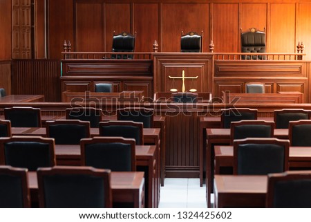 Red wood table and red chair in the justice court Royalty-Free Stock Photo #1324425602