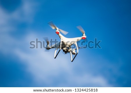 drone flying on the sky with camera / technology air and taking pictures for top view 