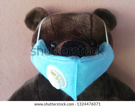Stuffed animals wearing a mask to cover the nose