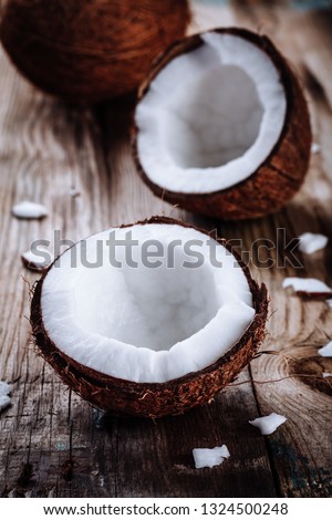 Fresh organic coconut on rustic wooden background
