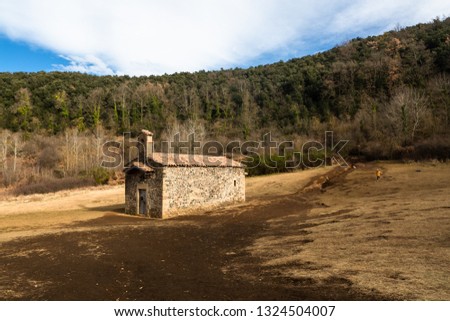 The hermitage of Santa Margarida in the crater of the volcano.