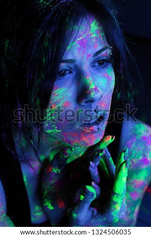 photo session of the girl in the studio with neon colors