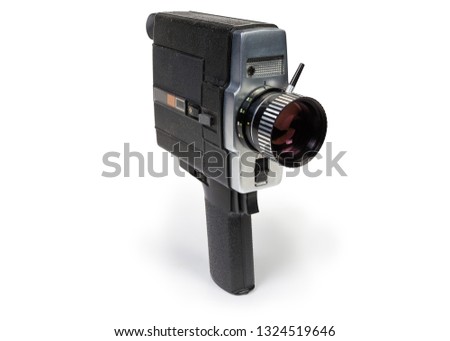 Old amateur film movie camera Super 8 mm format driven by  electric motor on a white background 
