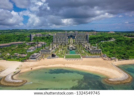 Aerial view of the beach and beautiful exotic hotel with swimming pools and gardens, Bali, Indonesia