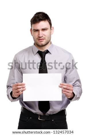 Handsome business man isolated on a white background looking confused holding a blank sign