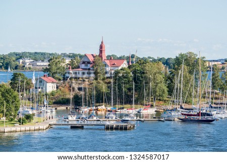 Islands in the Baltic Sea near Helsinki and a sunny day.The archipelago of Helsinki consists of around 330 islands, providing beautiful set-ups for days at the beach or weekend camping trips. 