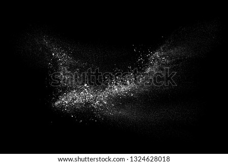 Freeze motion of white powder exploding, isolated on black background. Abstract design of white dust cloud. Royalty-Free Stock Photo #1324628018