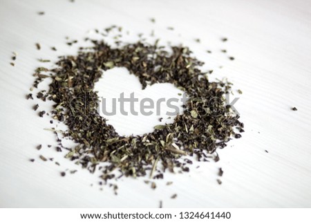 Natural heart from leaves of green and black tea