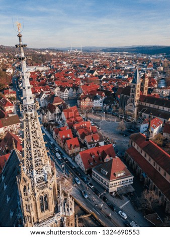 aerial drone shot of a medieval church in a small town in germany called esslingen am neckar