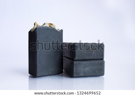 Activated charcoal artisanal rustic soaps  on isolated white background