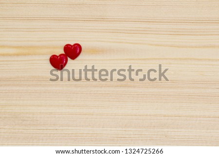 two hearts on a wood background. love concept 