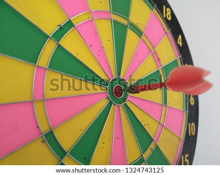 game of darts on the wall
