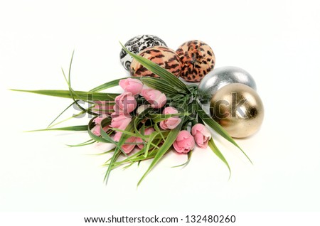 different Easter eggs and tulips on white background