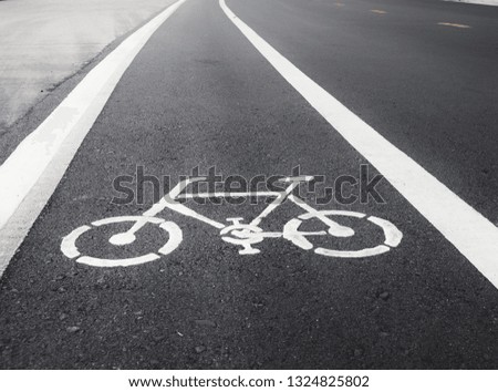 White painted bike on asphalt for riding bicycles in Thailand.