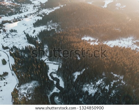 Amazing nature photos, icy lake in the middle of forest.