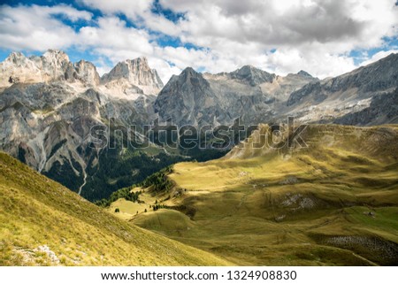 Green meadows and steep hills are the Dolomites
