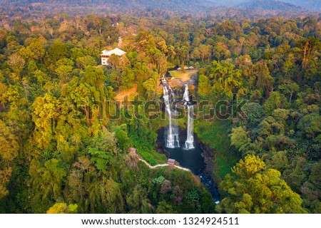 Top view Aerial photo from flying drone over Tad Gneuang Waterfall at Paksong  Champasak  Laos,ASIA.Tropical Waterfall in deep forest.